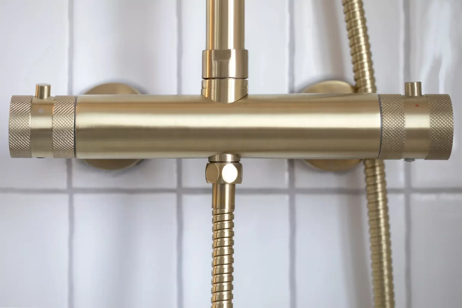 Brushed brass thermostatic shower valve with knurled detail