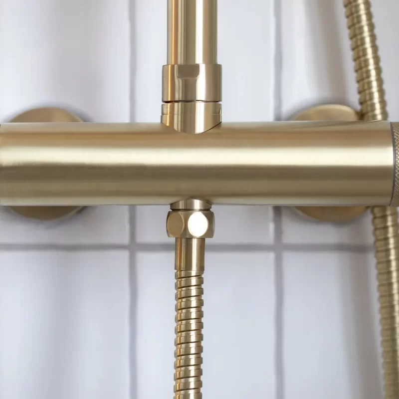 Brushed brass thermostatic shower valve with knurled detail
