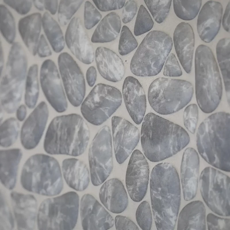 Close-up of textured grey pebble-effect wall tiles